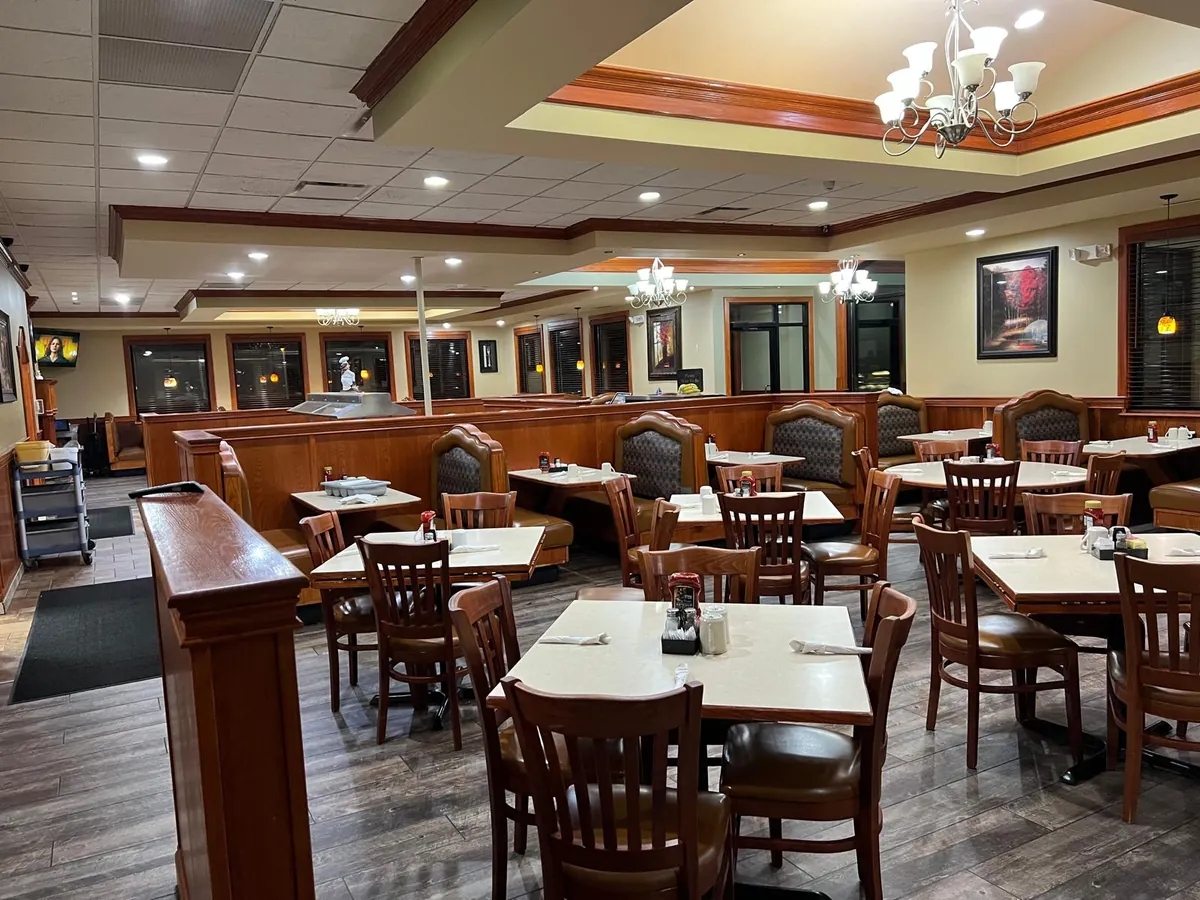 A wide view of the dining room set for guests